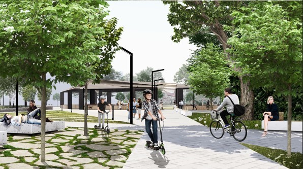 Wizualizacja fragmentu miasta. Grafika przedstawia obszar rekreacyjny ze ścieżkami rowerowymi, w tle rozległa altana. Dorośli i dzieci jeżdżą na rowerach i hulajnogach. Wzdłuż ścieżek szpalery drzew.